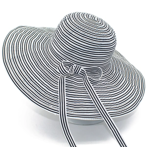 Chic black and white striped sun hat with wide brim and elegant bow for summer beach