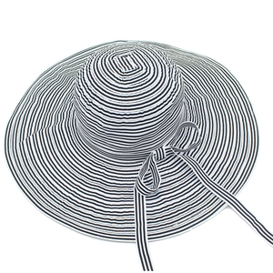 Top view of wide brim sun hat featuring elegant black and white stripes with bow detail