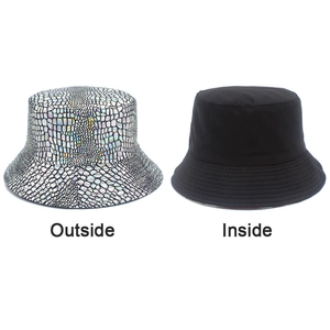 Detail showing the reversible design of the holographic snakeskin and black bucket hat