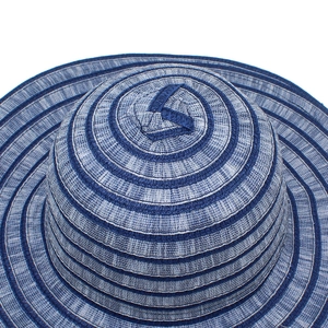 Detailed macro view of the blue and white striped texture on a woven sun hat for women