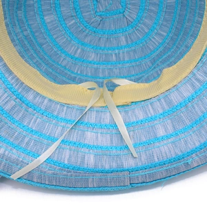 Detail of blue striped sun hat interior with inner sweatband and white chin straps