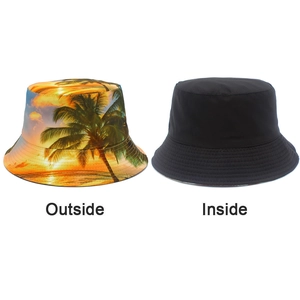 Reversible bucket hat detail showing tropical palm tree print and solid black side