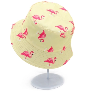 Pale yellow fisherman bucket hat featuring all-over pink flamingo prints for outdoor sun protection
