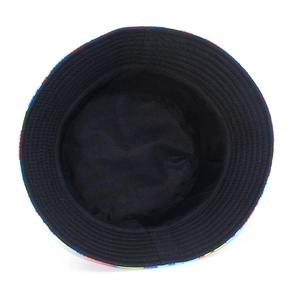Close-up of puzzle pattern bucket hat featuring multi-colored geometric blocks and stitching