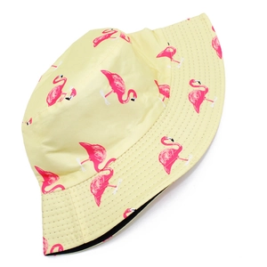Pale yellow reversible bucket hat with pink flamingo prints and reinforced brim stitching