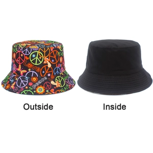Detailed comparison of reversible sun hat with colorful graffiti and solid black interior
