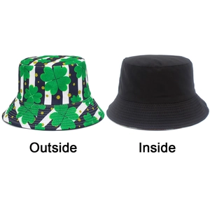 Double-sided bucket hat with green clover pattern and reversible black solid interior