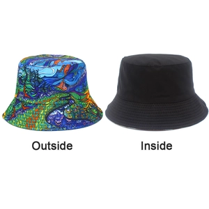Reversible bucket hat detail showing colorful artistic print and solid black interior side