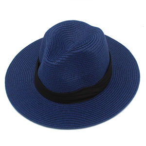 Detailed view of navy blue straw Panama hat featuring a black ribbon band and fedora style