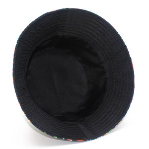 Inside view of double-sided bucket hat with black lining and colorful graffiti print