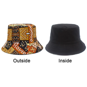 Detail of reversible bucket hat showing geometric pattern outside and solid black inside