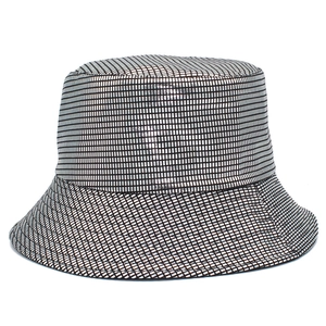 Close-up of metallic silver bucket hat with fine square texture and reflective PU finish