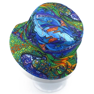 Detailed close-up of a double-sided bucket hat with vibrant geometric abstract patterns