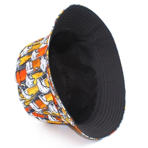 Detail of reversible bucket hat with yellow beer print and minimalist black interior