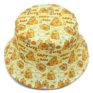 Close-up of yellow bucket hat featuring cute cartoon capybara prints and patterns