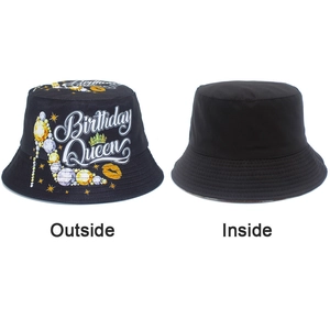 Detail of reversible black bucket hat with Birthday Queen print and high heel graphics
