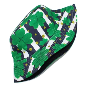 Close-up of St. Patrick's Day bucket hat with green clover print and striped details