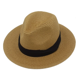 Detailed close-up showing the dense woven texture and black ribbon of the straw Panama hat