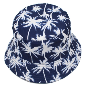 Navy blue reversible bucket hat with white palm tree print for outdoor sun protection
