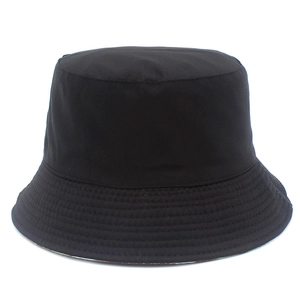 Detailed close-up showing fabric texture and parallel stitching on a black cotton bucket hat