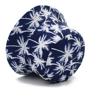 Navy blue reversible bucket hat with tropical palm tree print for outdoor sun protection