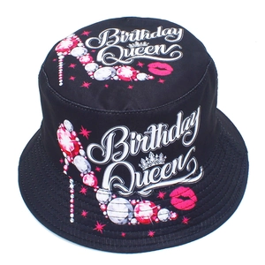 Detail of Birthday Queen print on black bucket hat with high heel and lip pattern