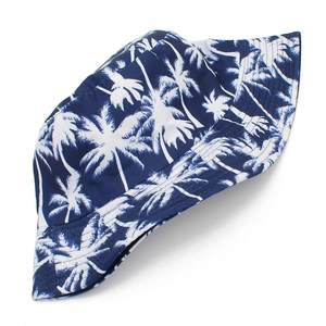 Navy blue reversible bucket hat with white palm tree print for outdoor sun protection