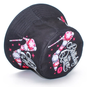 Detail view of Birthday Queen crown and red lips print on black cotton bucket hat