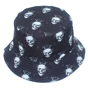 Black bucket hat with all-over white skull and crown print for street style fashion