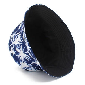 Detail of double-sided bucket hat with white palm tree print and stitching