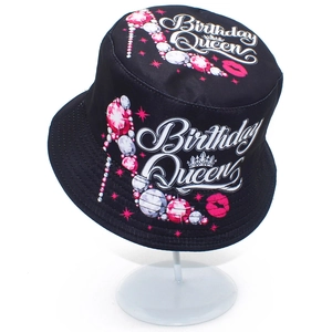Detail of Birthday Queen print on black bucket hat with pink high heels and crown