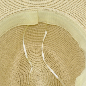 Detailed macro view of straw Panama hat interior with adjustable sweatband and woven texture