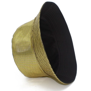 Macro shot of gold sequin bucket hat showing metallic square texture and black lining