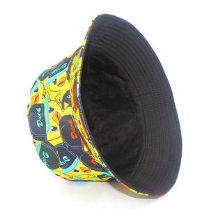 Reversible bucket hat with yellow cartoon duck print and solid black inner lining
