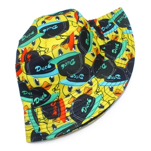 Detail of yellow bucket hat with cartoon duck prints and street style duck patterns