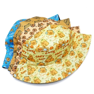 Detailed view of Capybara printed bucket hats in blue, khaki, and beige cotton canvas