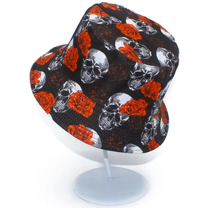 Reversible bucket hat featuring white skulls and red roses on black canvas material