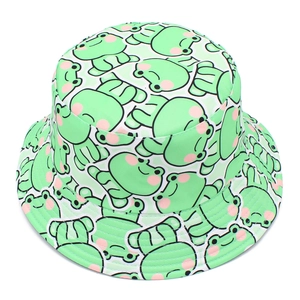 Detailed view of the frog pattern bucket hat featuring vibrant green twill cotton and stitching