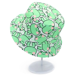 Close-up detail of green cotton bucket hat with cute cartoon frog pattern print