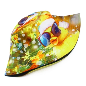 Detail of cute yellow duck print with Christmas hat on fabric of bucket sun hat