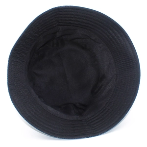 Detailed interior view of a black fabric sun hat showing refined stitching and texture