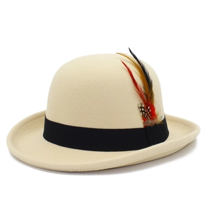 Classic creamy wool felt fedora hat with black grosgrain band and vintage feather detail