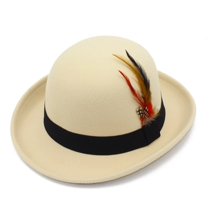 Detailed shot of beige wool felt fedora with black grosgrain ribbon and colorful feather