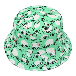 Close-up of cute cartoon frog patterns on a green outdoor bucket hat for sun protection