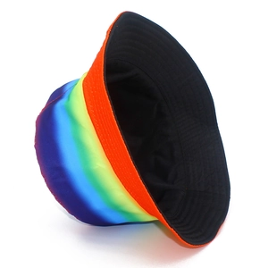 Rainbow striped bucket hat for sun protection featuring a reversible black inner lining