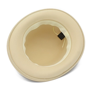 Detail view of the fedora hat interior showing 65% cotton blend label and adjustable strap