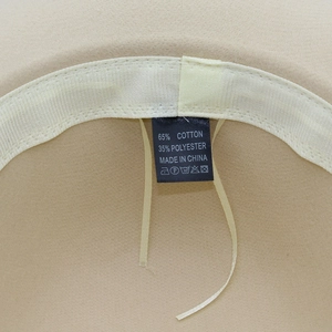 Detail view of the interior sweatband and material label showing 65% cotton composition