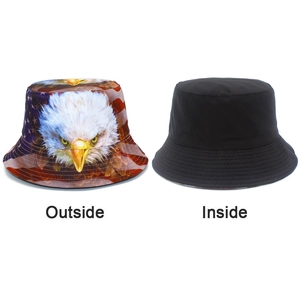 Detail of reversible bucket hat showing eagle print and solid black lining inside