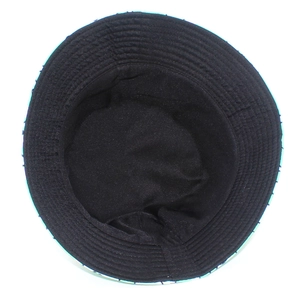 Detail view of the black fabric inner lining and stitching of the cartoon frog bucket hat