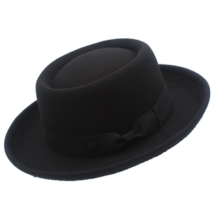 Classic black wool felt pork pie hat with elegant grosgrain ribbon for men and women